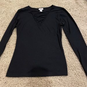 Black long sleeve top with criss cross detail on neck line
